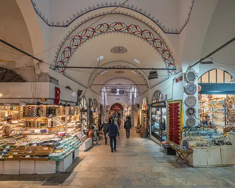 A vaulted stone corridor lined with shops inside Istanbul's Grand Bazaar
